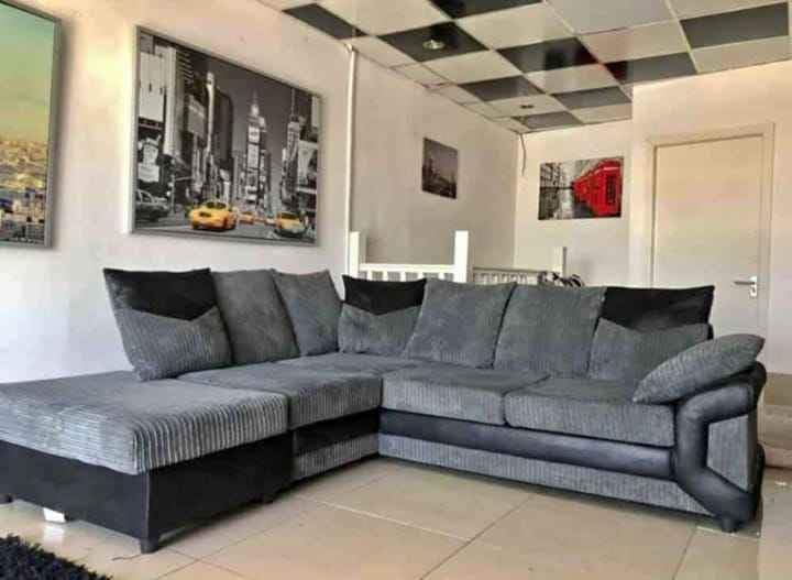 New Large Grey Corner Sofa LARGE-DINO-CORNER-SOFA-GREY-BLACK-LEFT-HAND-SIDE-FOAM. Fire Resistant as per British Standards, Foam Filled Seats for Comfort.