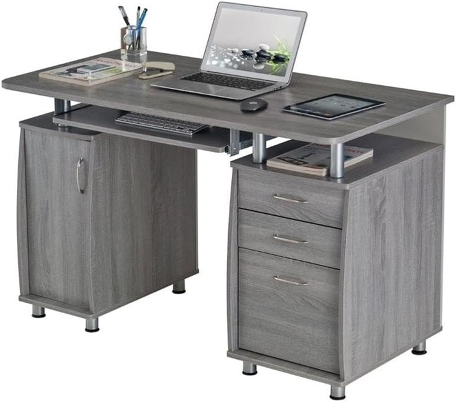 Gray wooden office desk with laptop, keyboard, and other items on a white background