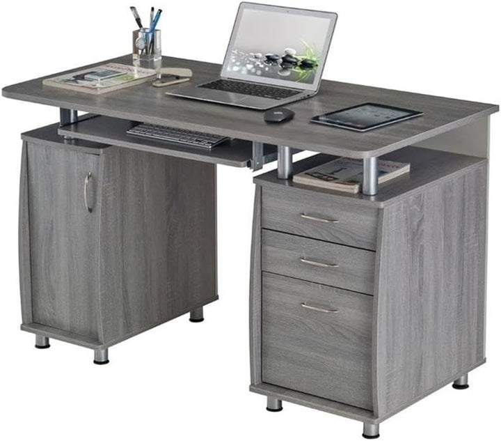 Gray wooden office desk with laptop, keyboard, and other items on a white background