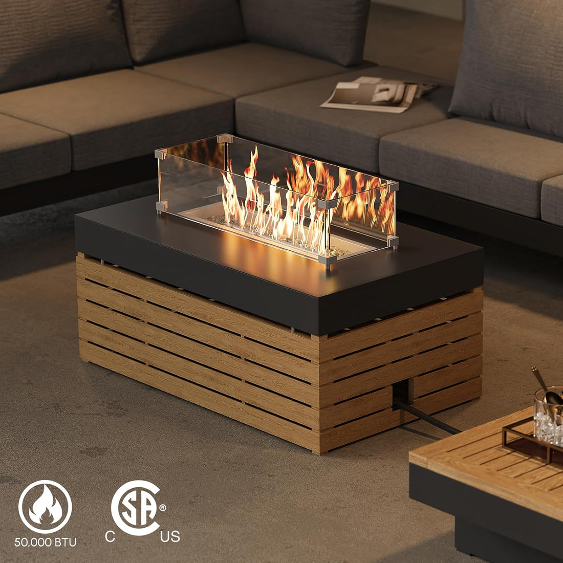Wooden fire pit table with flames in a living room setting, featuring certification logos.