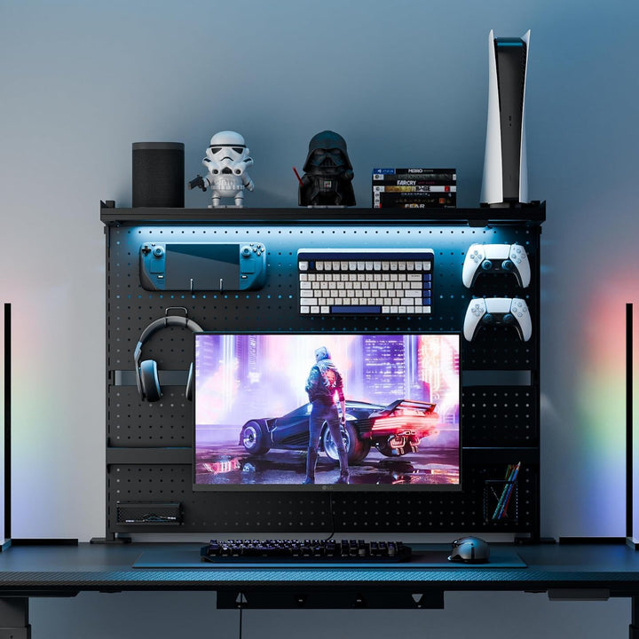 Gaming setup with monitor, keyboard, mouse, and gaming accessories on a desk.