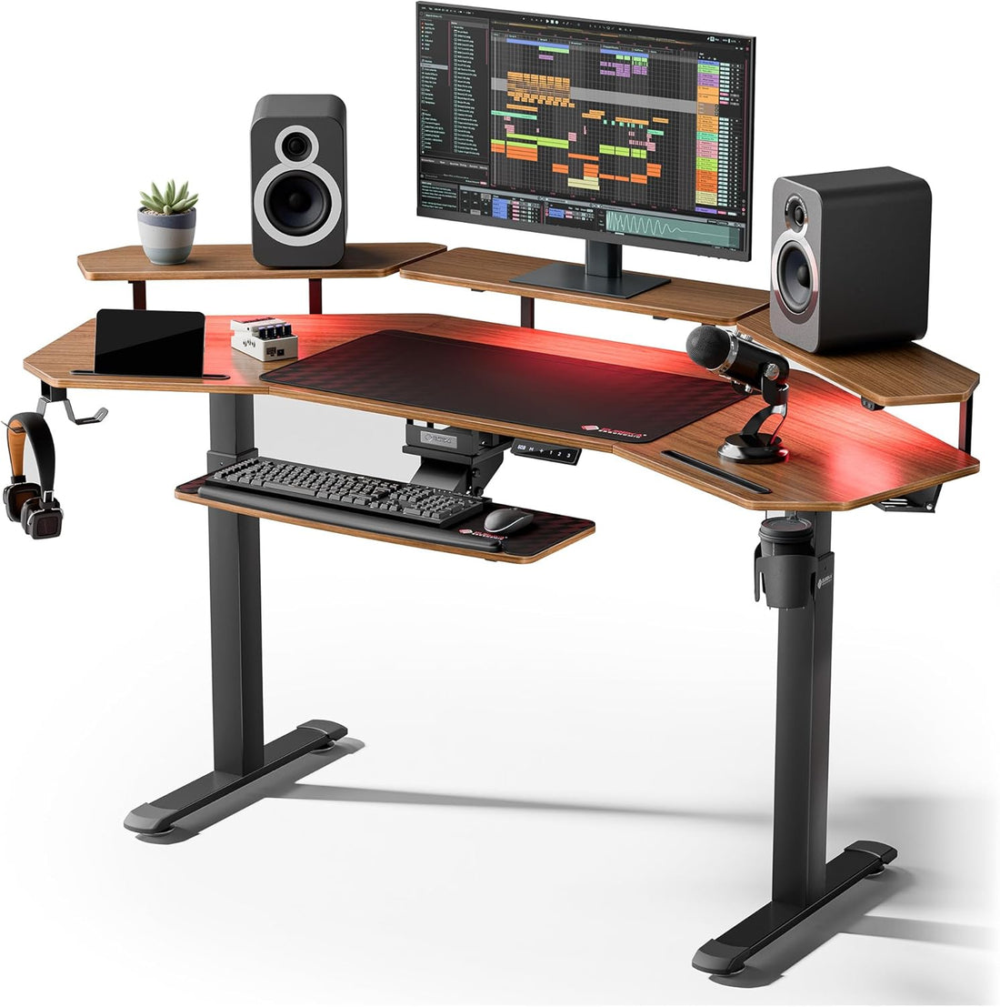Computer desk setup with a monitor, keyboard, mouse, and speakers on a white background