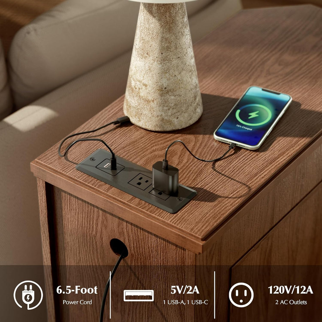 Wooden side table with power outlet, lamp, and smartphone charging on a neutral background