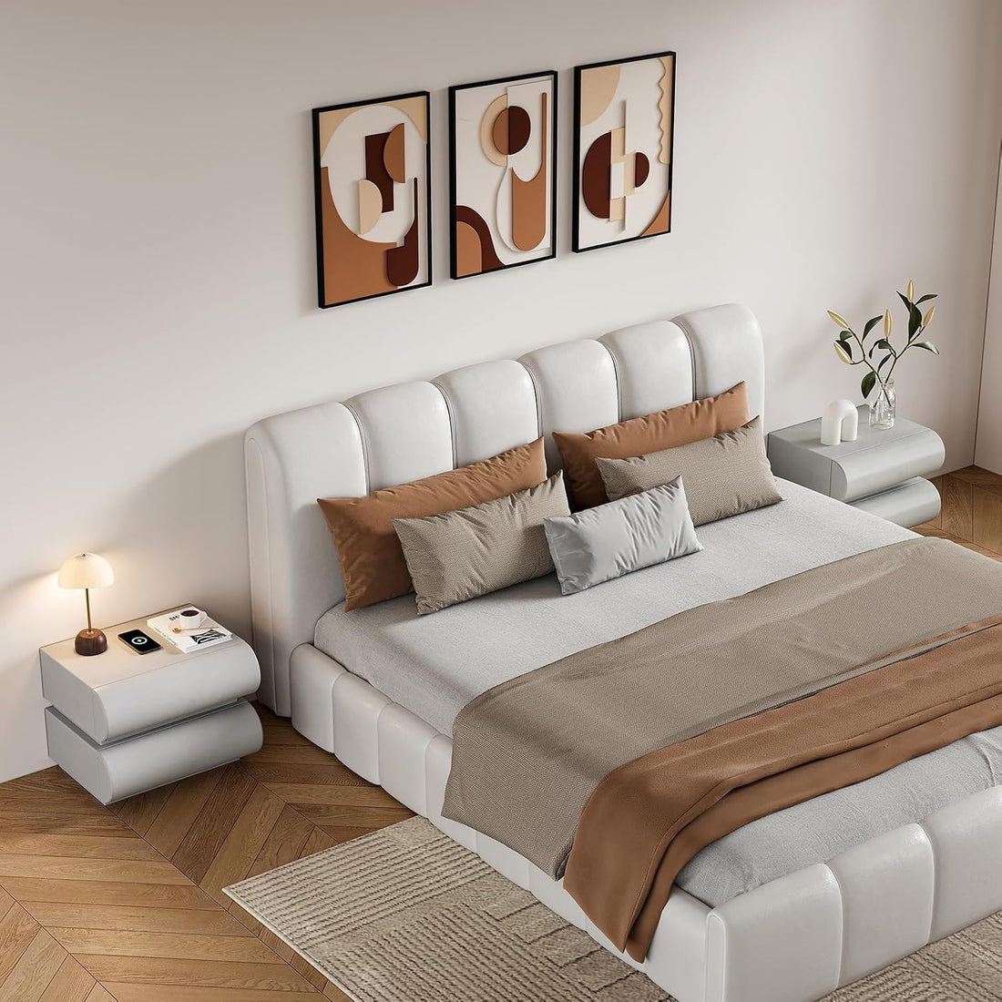 Modern bedroom with a white upholstered bed, brown and gray bedding, and abstract wall art.