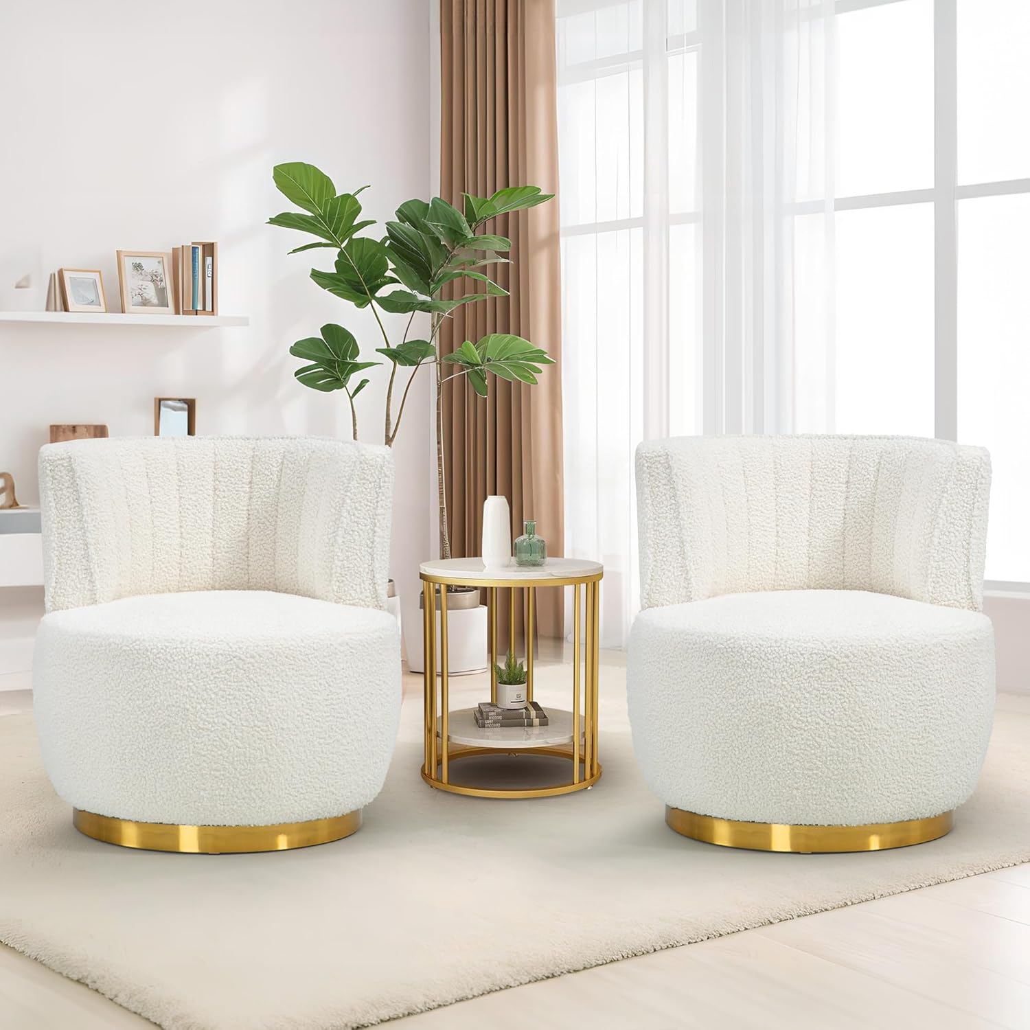 Two white armchairs with gold bases in a living room setting.