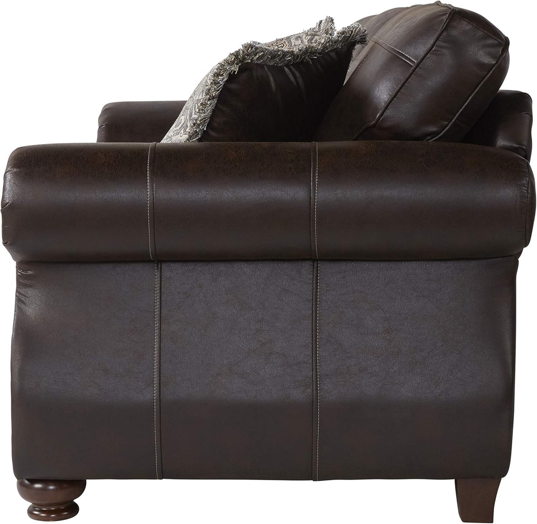 Brown leather sofa with a textured throw blanket on a white background