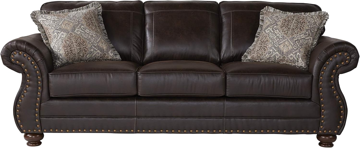 Brown leather sofa with decorative pillows on a white background