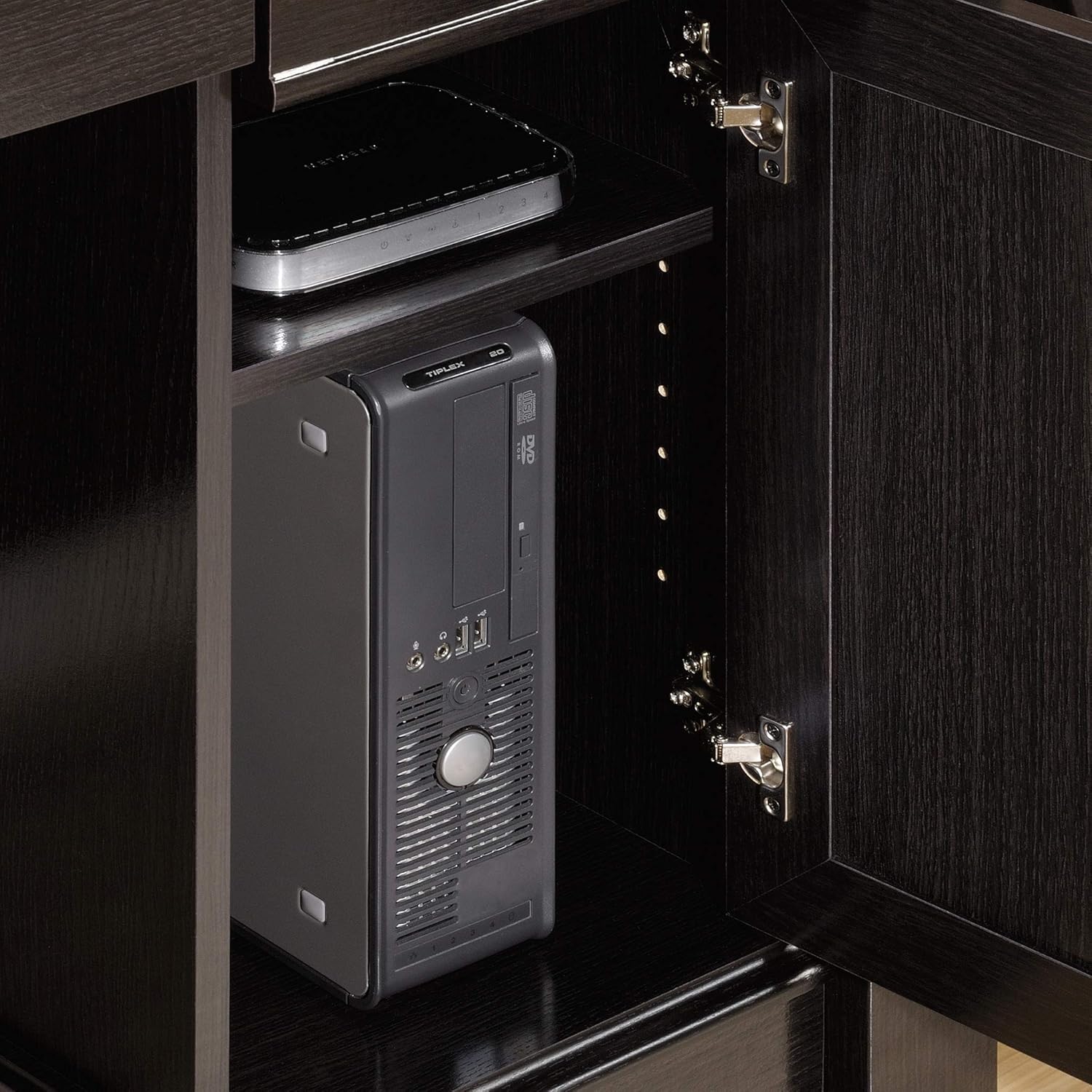 Electronic device with keypad inside a dark wooden cabinet