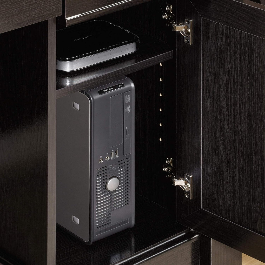 Electronic device with keypad inside a dark wooden cabinet