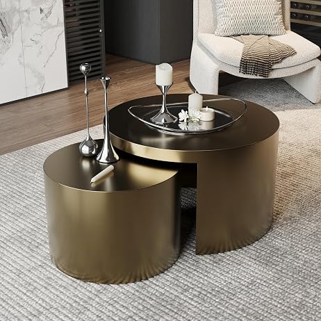 Modern gold coffee table with decorative items in a living room setting