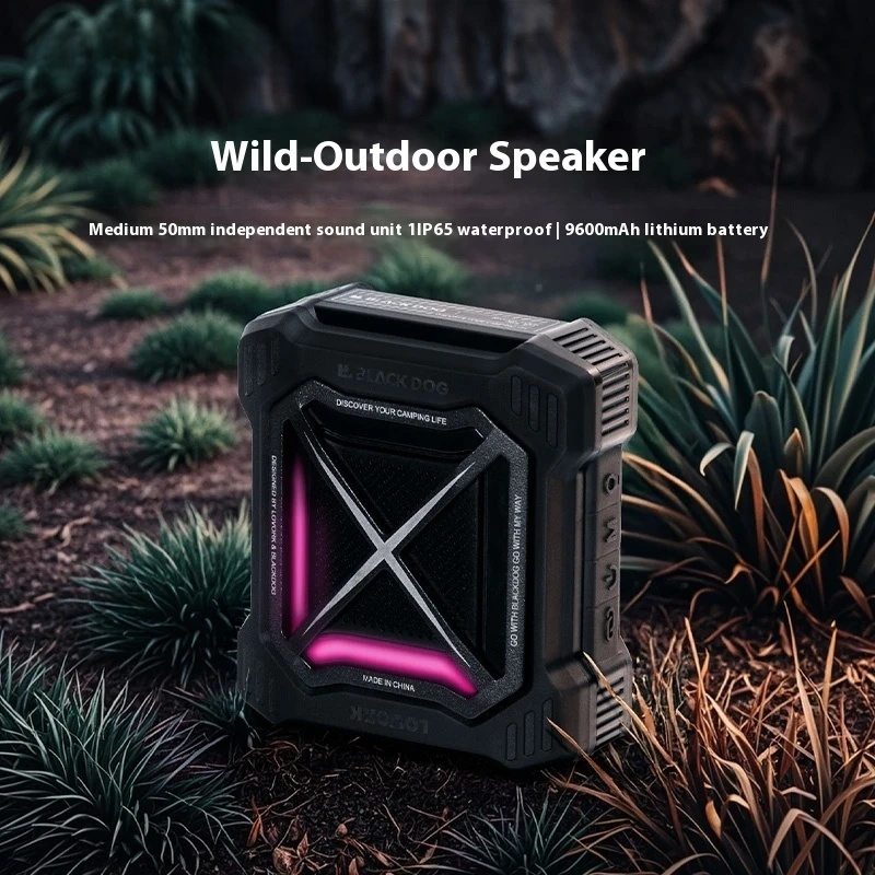 Black outdoor speaker with pink accents in a natural setting