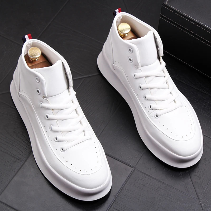 Pair of white high-top sneakers on a dark wooden floor.