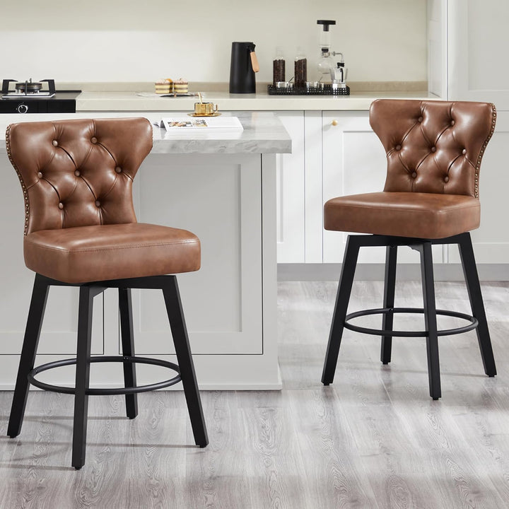 Two brown leather bar stools with black legs in a kitchen setting.