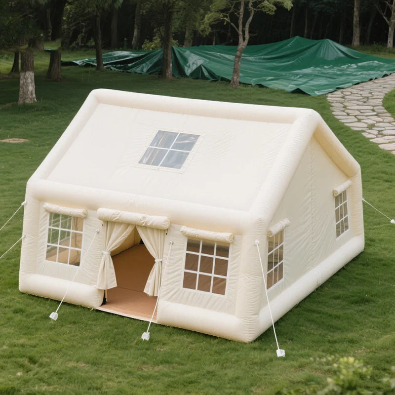 Inflatable tent on grass with trees in the background