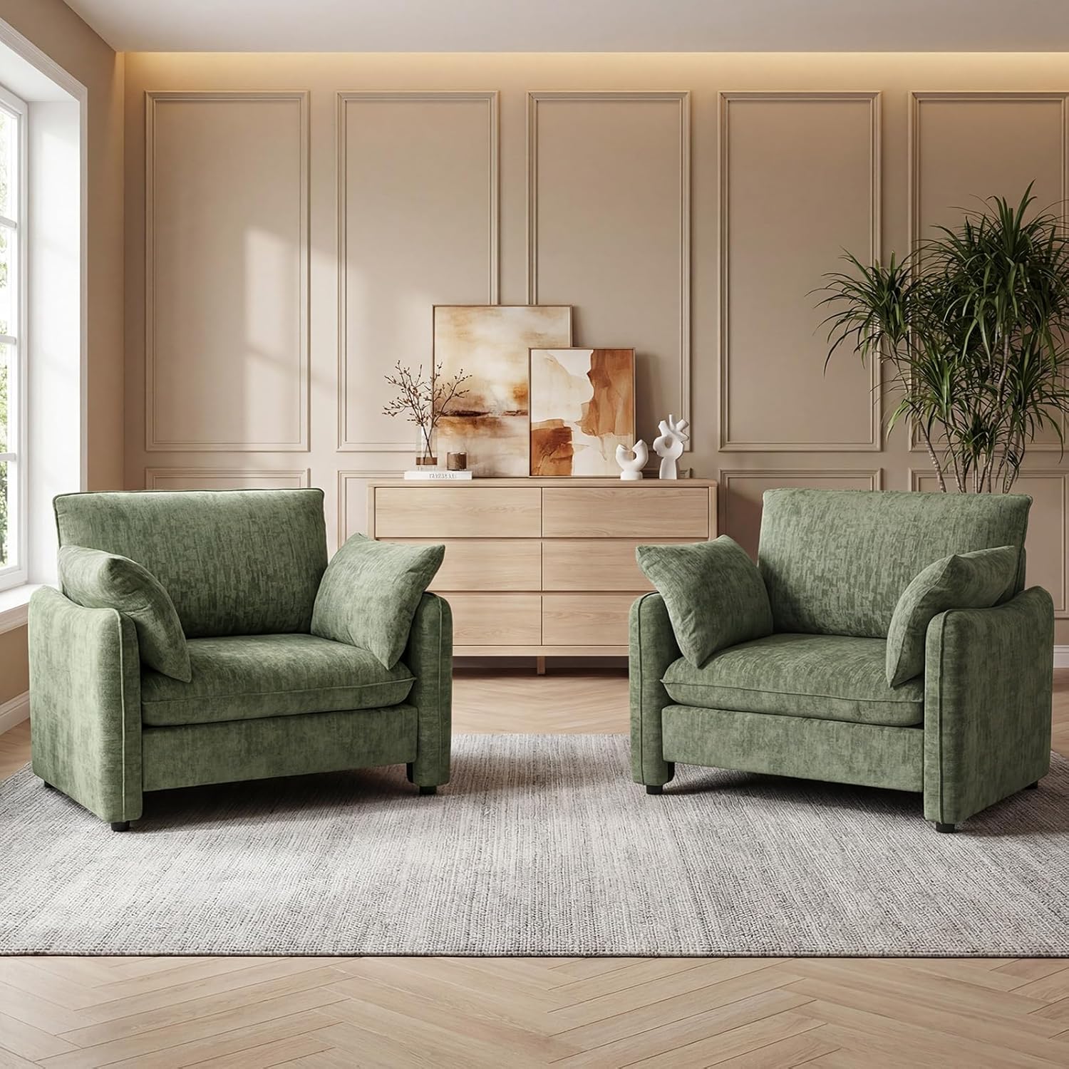 Two green armchairs in a living room with a neutral color scheme.