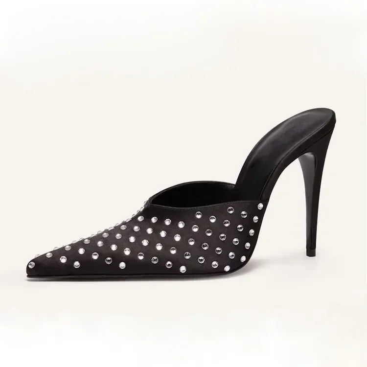 A single black pointed-toe mule high heel shoe embellished with silver rhinestones, shown from a side profile on a light off-white background.
