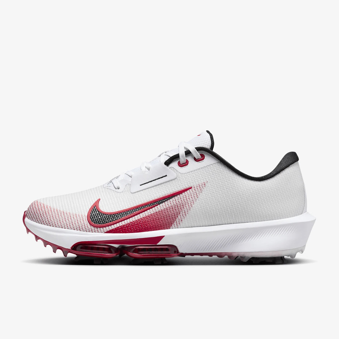 A Nike golf shoe in white, red, and black, featuring a white mesh upper, a red gradient Swoosh, and a white sole with red air cushioning.