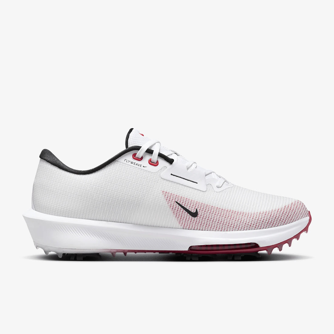 A Nike golf shoe in white with a textured knit upper, a black swoosh, and a pinkish-red gradient pattern on the side, set against a light gray background.