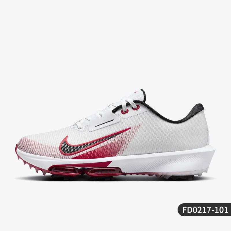 A Nike golf shoe in white, red, and black, shown from a side profile view against a light gray background.