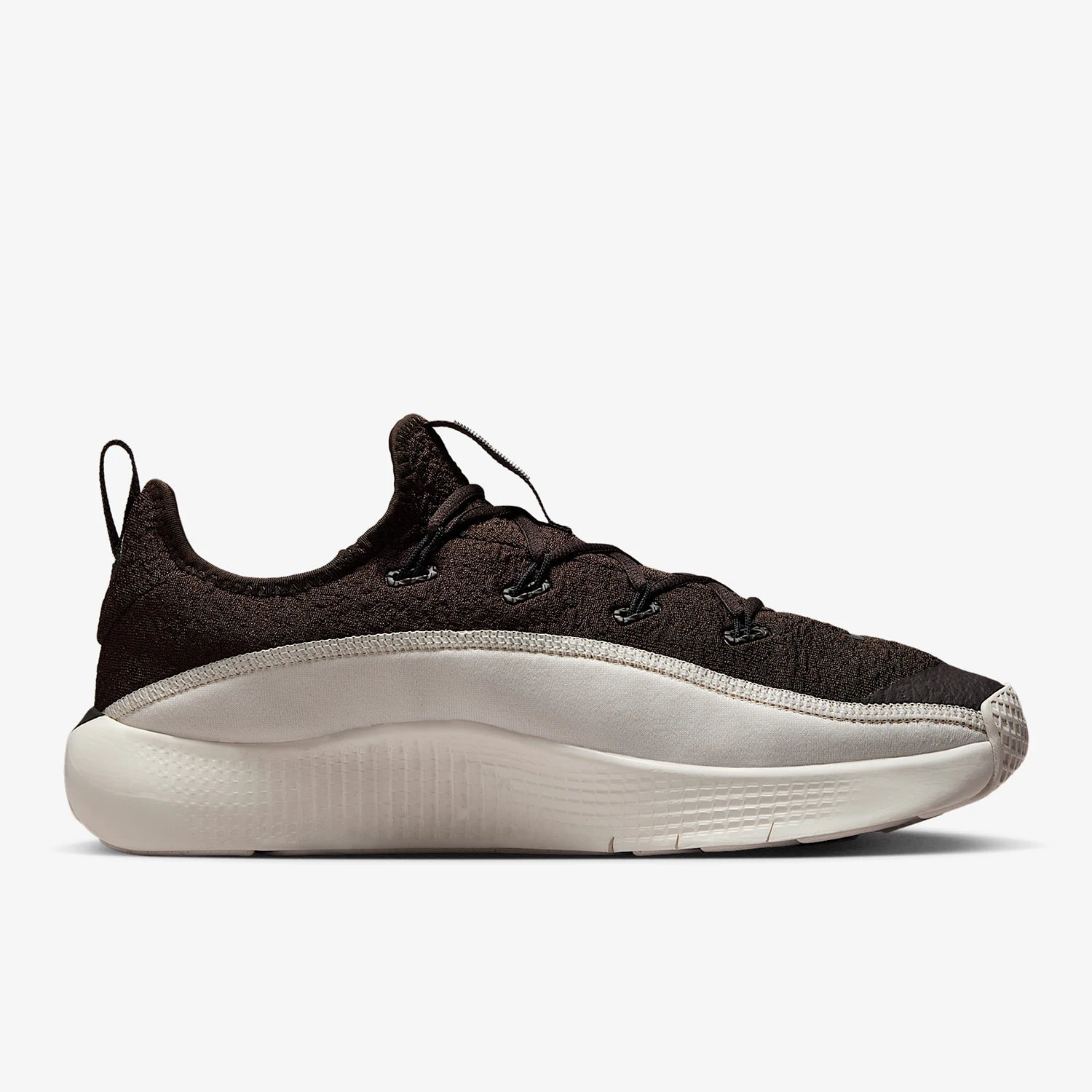 Black sneaker with white sole on a white background