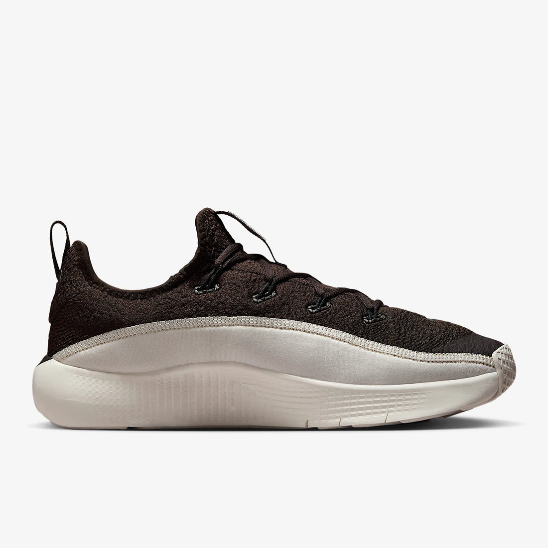 Black sneaker with white sole on a white background