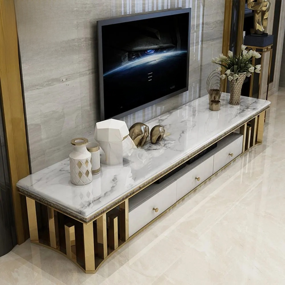 Modern TV stand with marble top and gold accents in a living room setting.