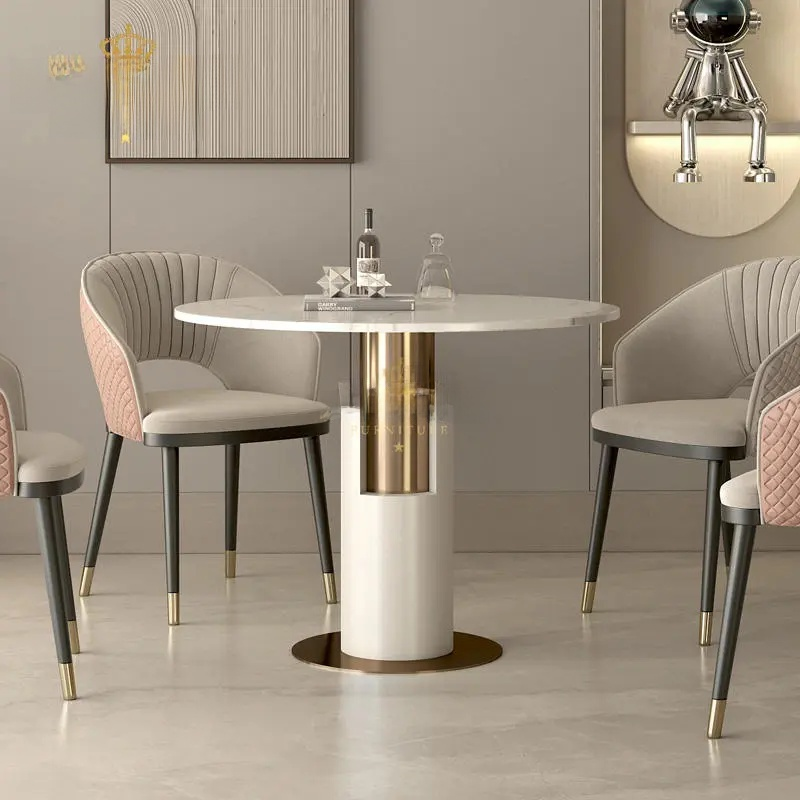 Modern dining room with a round table and chairs in a stylish interior.