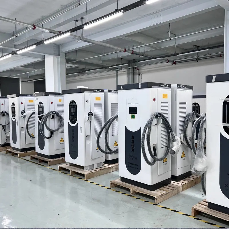 Row of electric vehicle charging stations in a warehouse setting