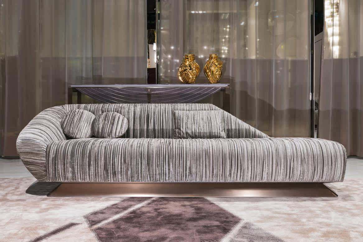 Modern gray sofa in a stylish room with decorative elements.