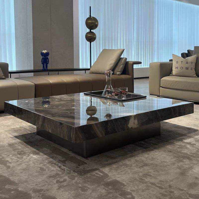 Modern living room with a marble coffee table and stylish furniture.