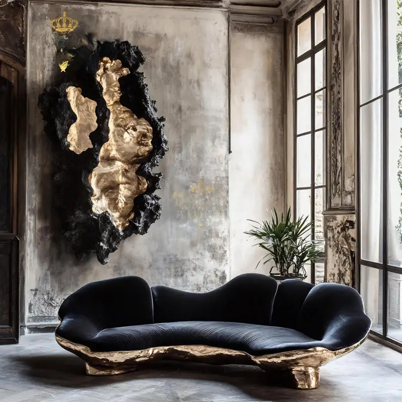 Modern black and gold sofa in a stylish room with large windows.