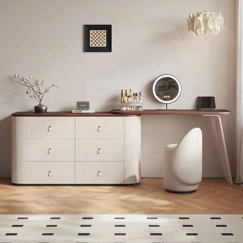 Modern interior with a white dresser, wooden sideboard, and decorative items.