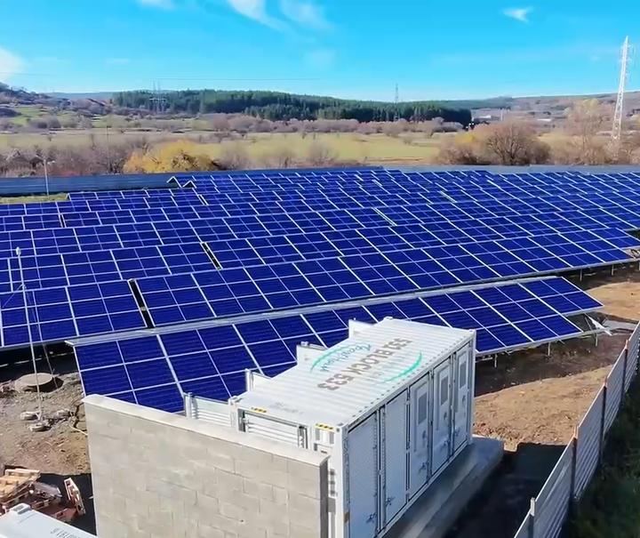 Solar panels installed on a field with a clear sky