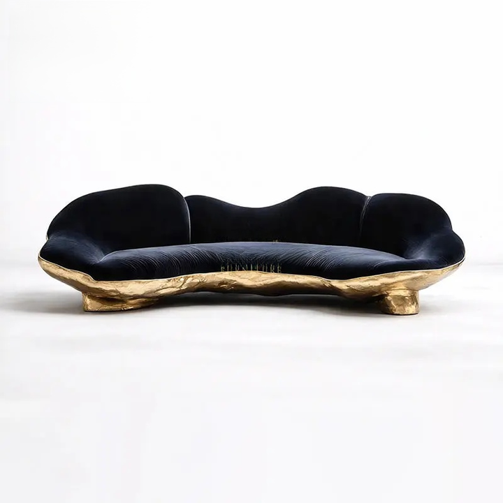 Modern black sofa with gold base on a white background