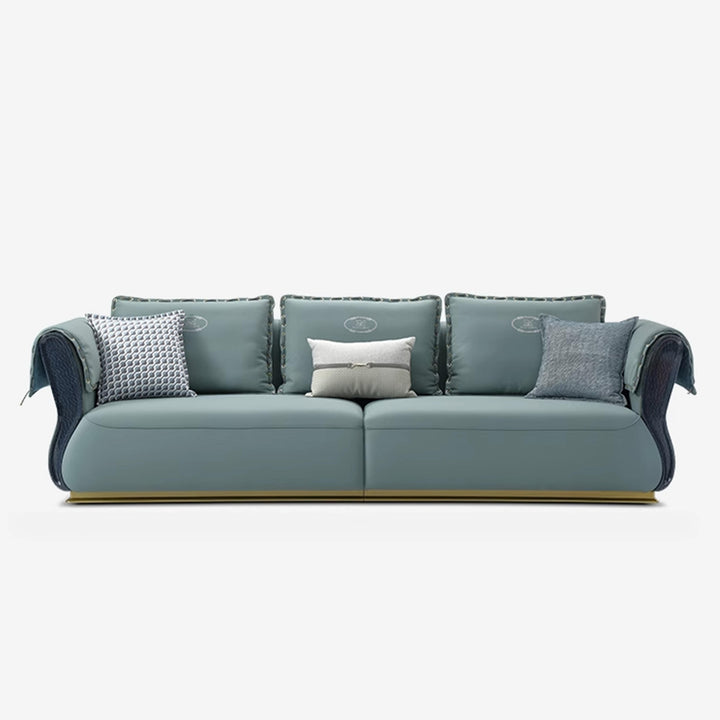 Blue sofa with decorative pillows on a white background