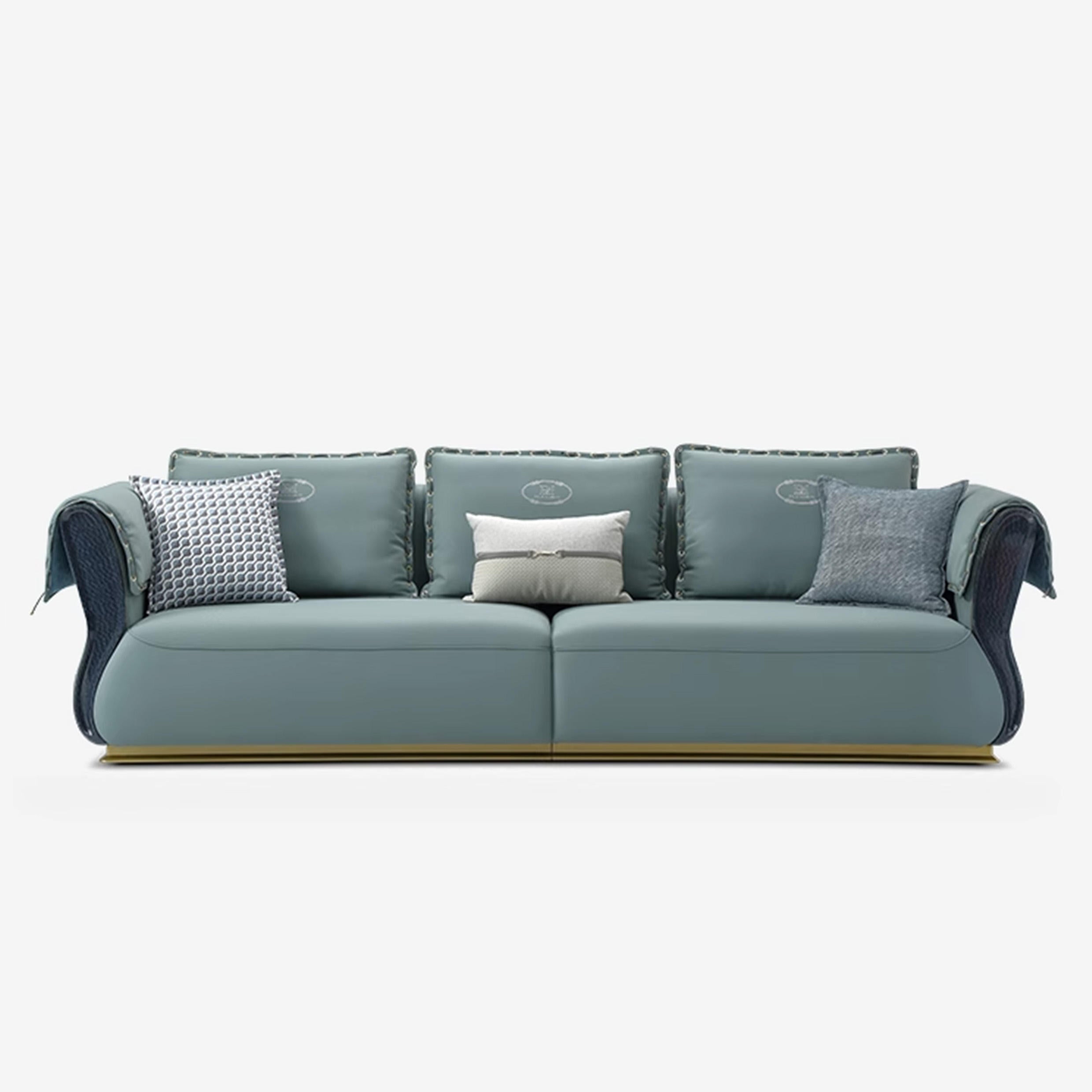 Blue sofa with decorative pillows on a white background