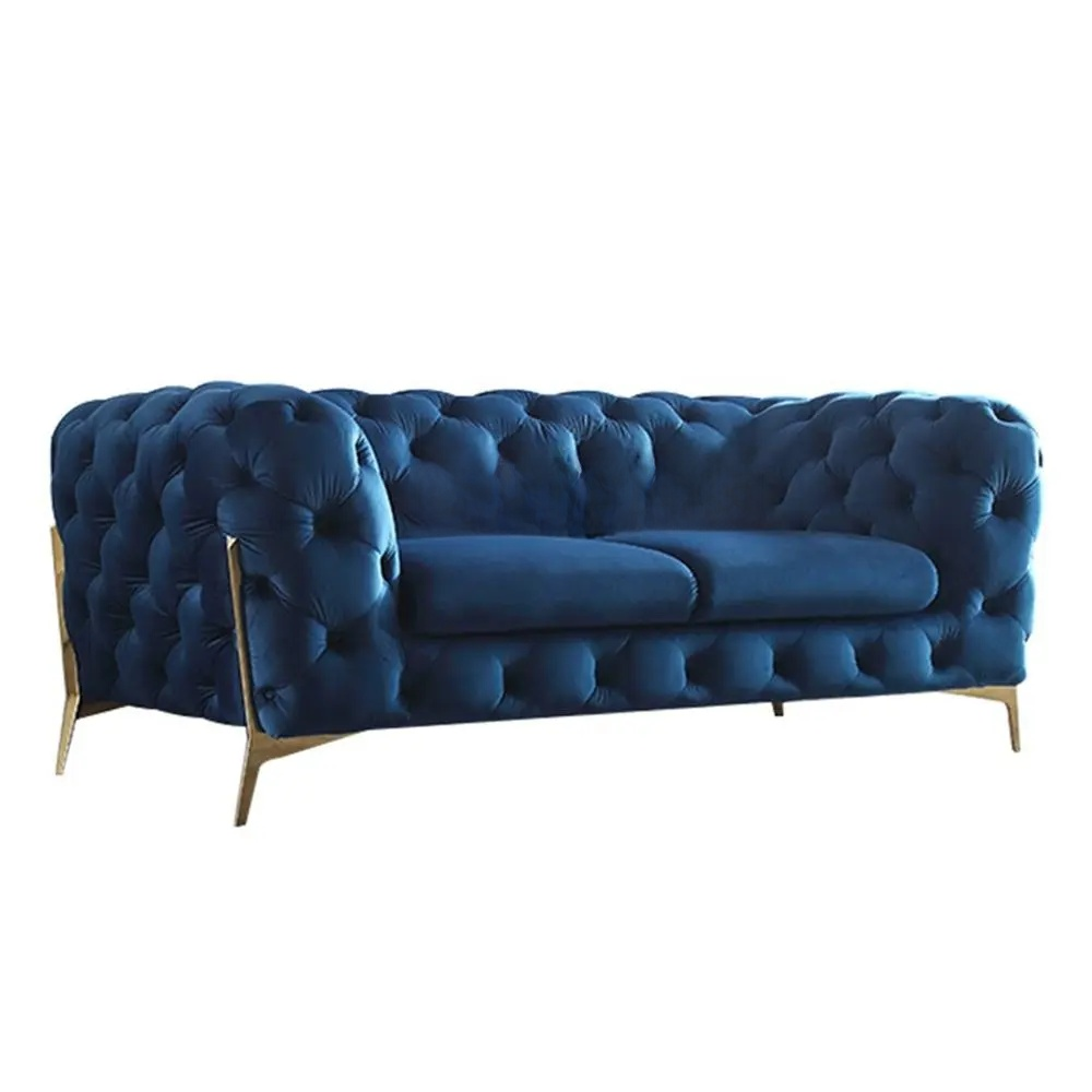 Blue tufted sofa on a white background