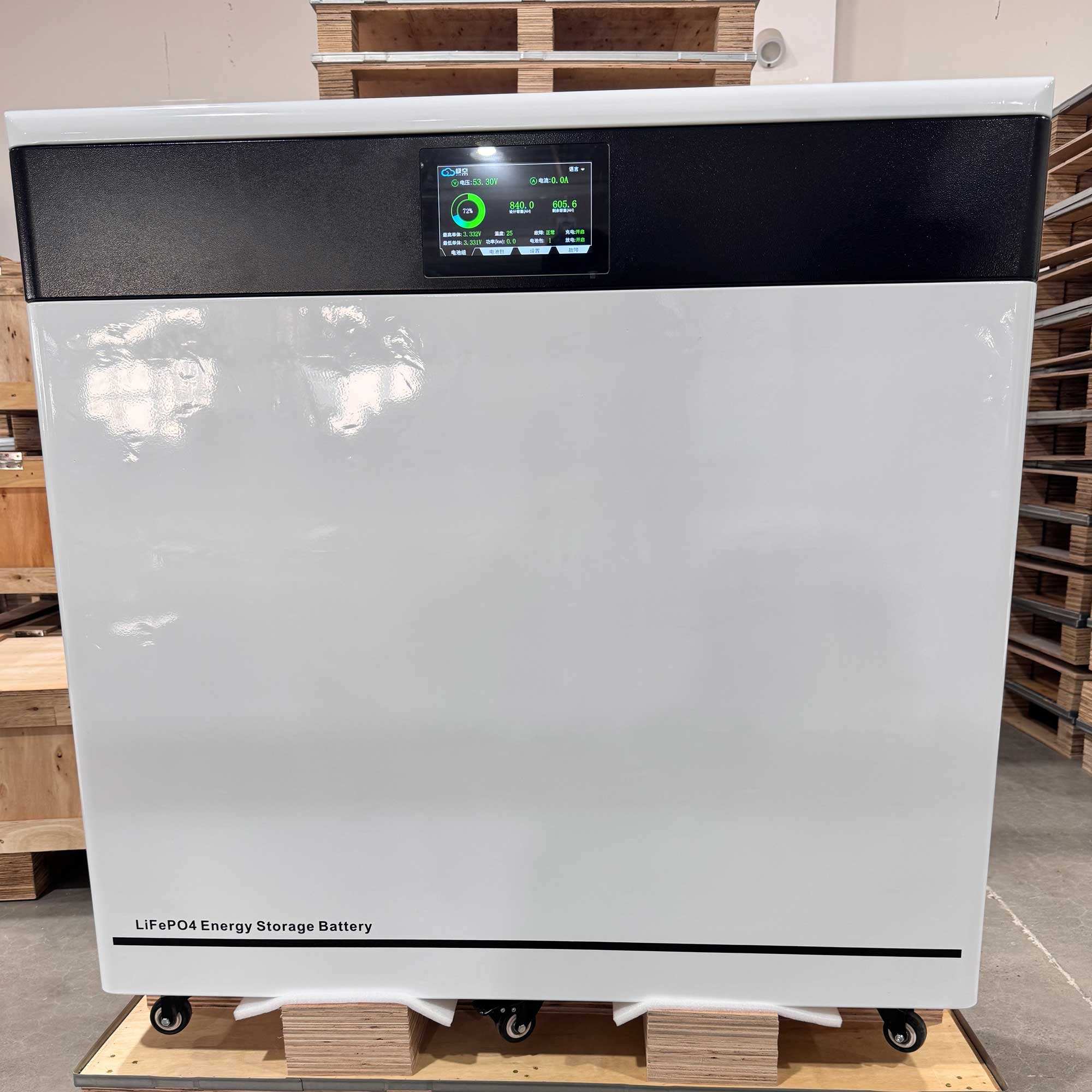 Energy storage battery on a pallet with wooden pallets in the background