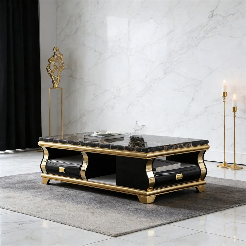 Luxury black and gold coffee table with marble top in a stylish room.