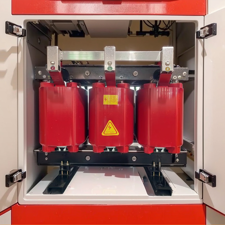 Red electrical transformer with a warning label inside a cabinet