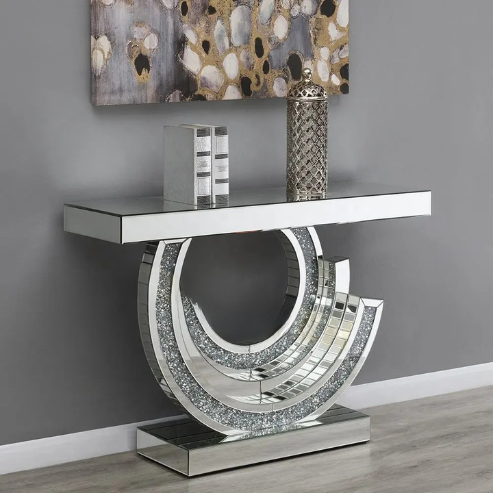 Decorative console table with a modern design against a gray wall.