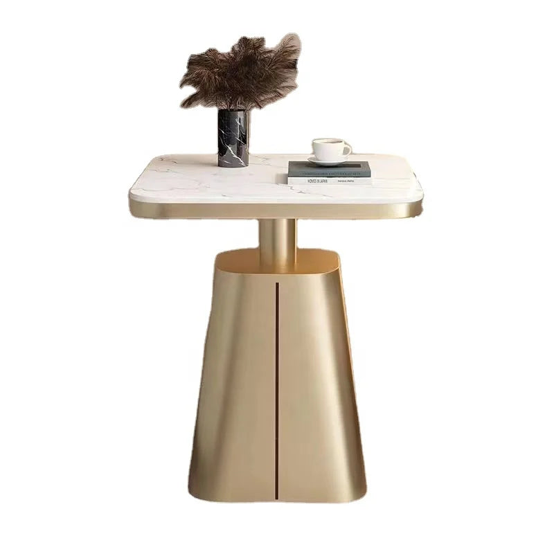 Gold side table with marble top on a white background