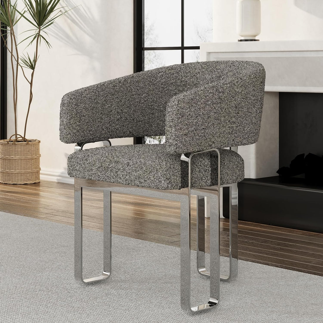 Two gray upholstered chairs with metal legs in a modern interior setting.