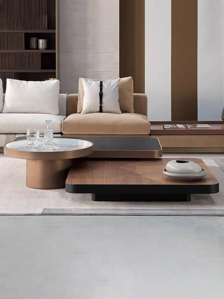 Modern living room with a sofa, coffee table, and decorative items.