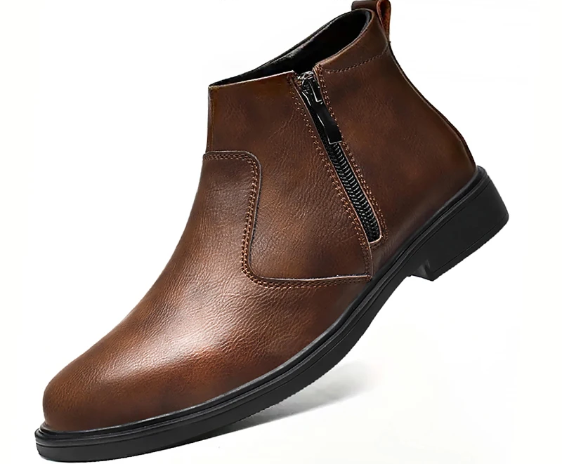A brown faux-leather ankle boot with a side zipper, elastic side gore, and a low black sole, shown on a white background.