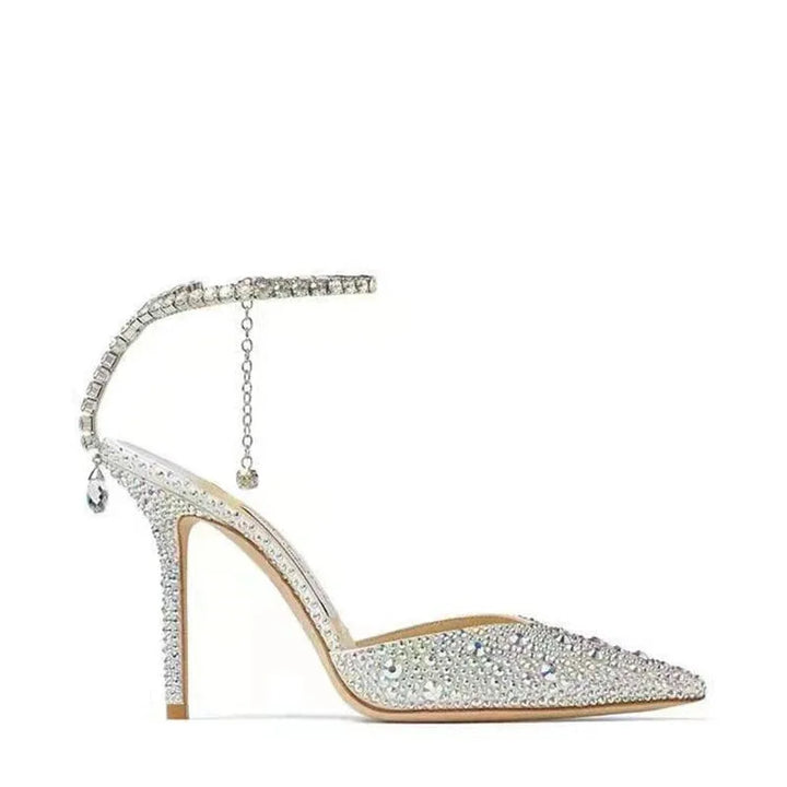 High-heeled shoe with crystal embellishments on a white background
