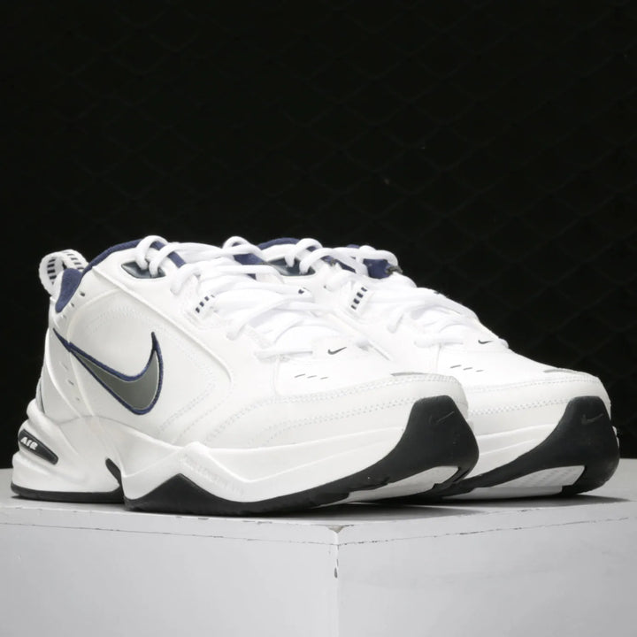 White Nike sneakers with black and gray accents on a white background