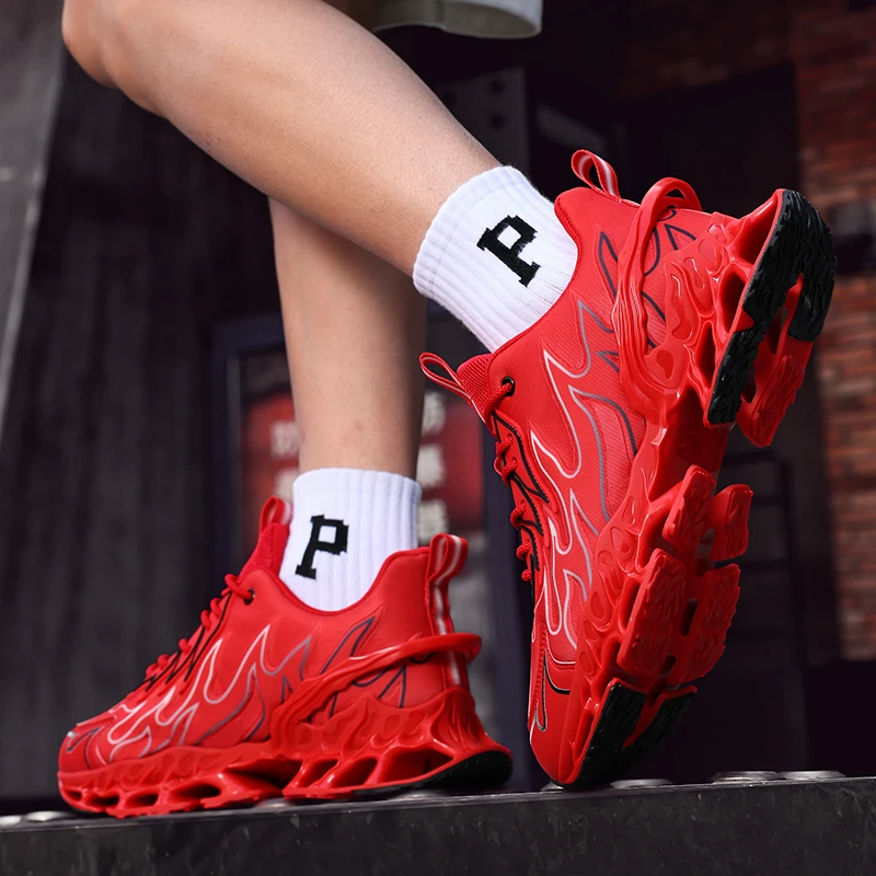 Red sneakers with flame design worn by a person, on a blurred background