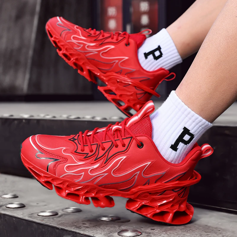 Red athletic shoes with unique sole design worn by a person on a metallic surface.