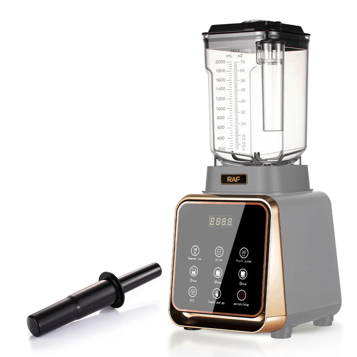 A modern countertop blender with a gray base, black lid, clear pitcher, and metallic rose-gold trim. The base features a glossy black control panel with white icons and a digital display.